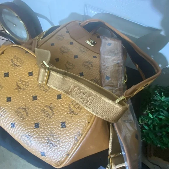 MCM small Cognac back pack with storage bag.